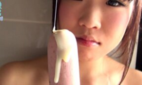 Cutie Uri in bikini playing with dildos in bathroom